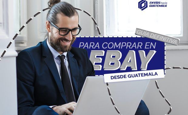 hombre de 30 años, cabello largo recogido, con traje elegante y con una laptop blanca comprando en ebay
